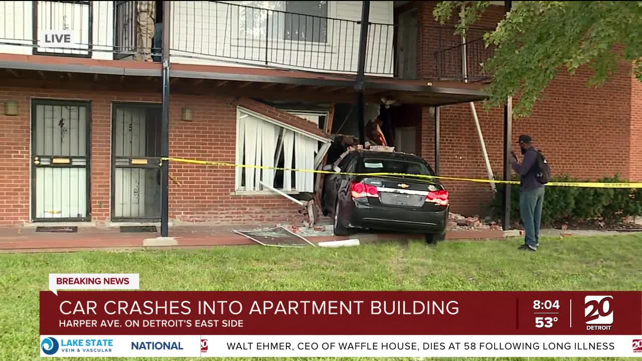 Car crashes into Detroit apartment building just after woman arrives home