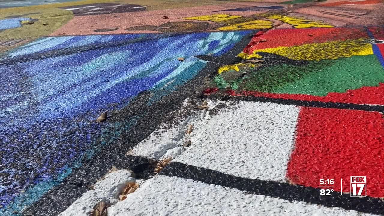 'I was devastated' Kalamazoo mural defaced by tire marks