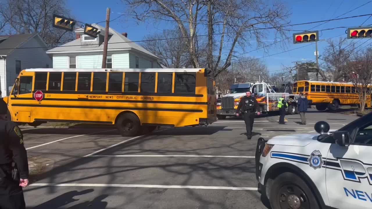School bus collides with other bus, crashes into Newport News house